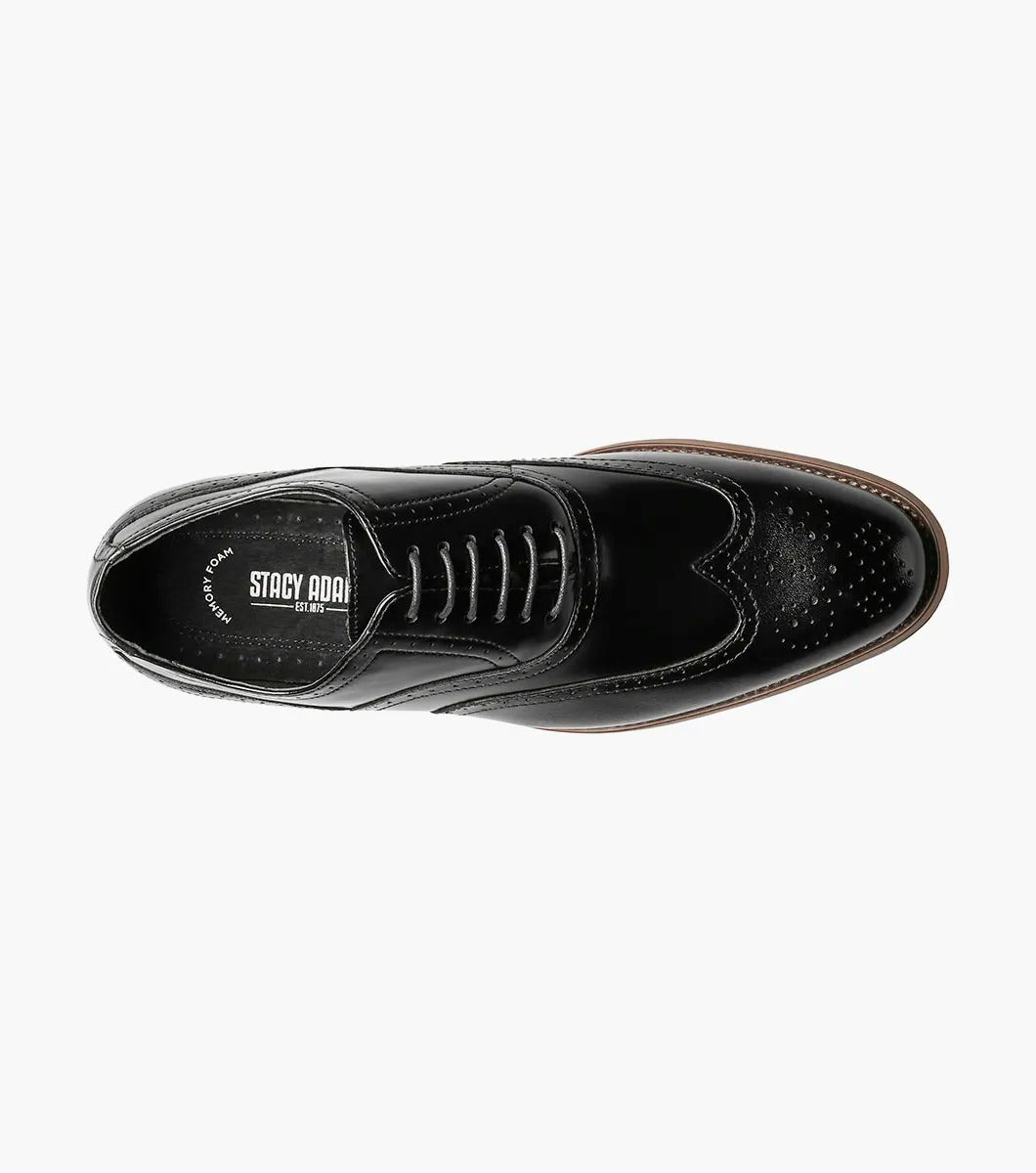 The Stacy Adams DUNBAR Wingtip Oxford in black features decorative perforations, a tan sole, and a comfortable memory foam insole.