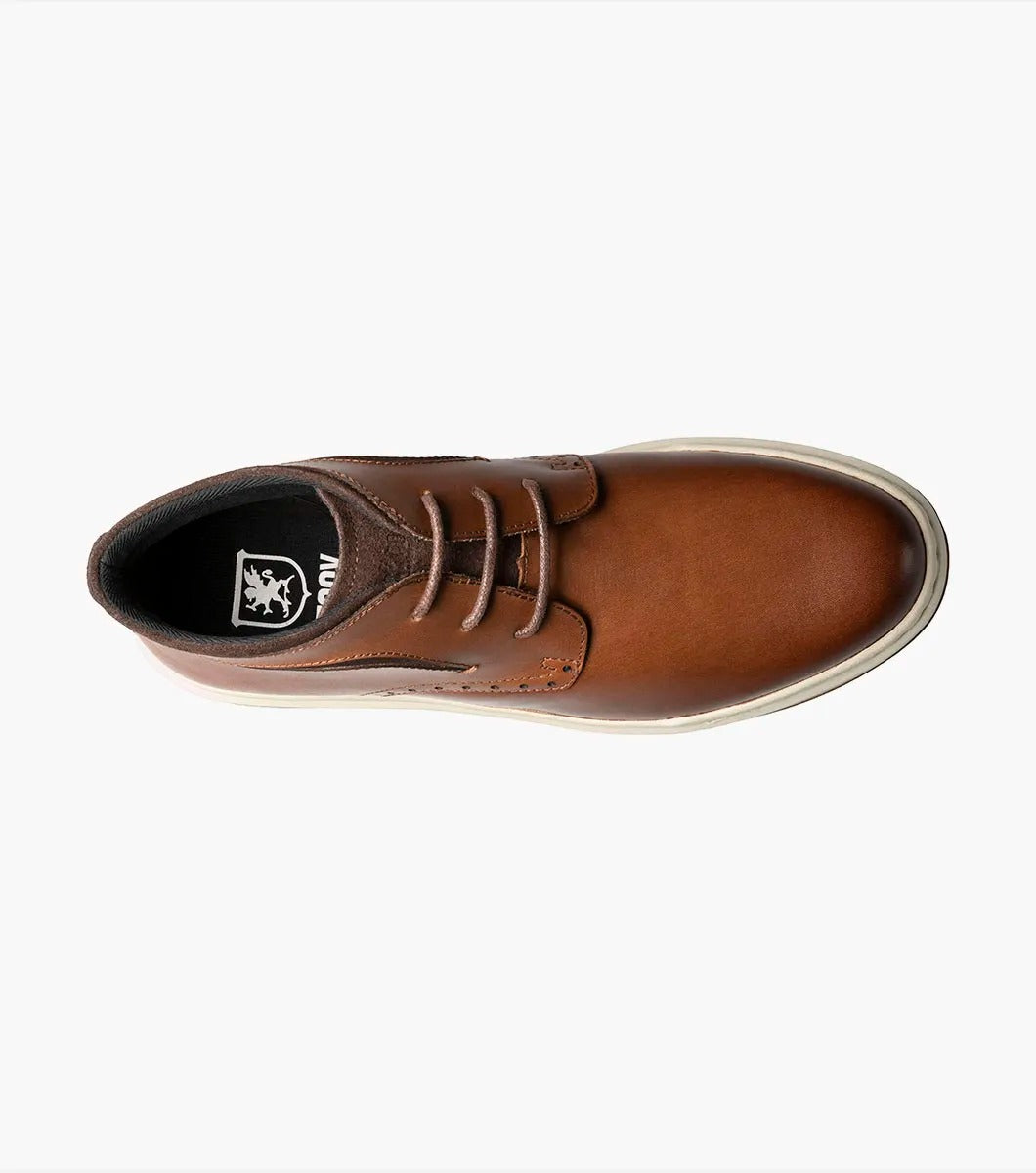 Stacy Adams' CORBIN Plain Toe Chukka Boot features a cognac smooth finish with decorative perforations, a comfortable insole, white sole, and brown laces displayed on a plain white background.