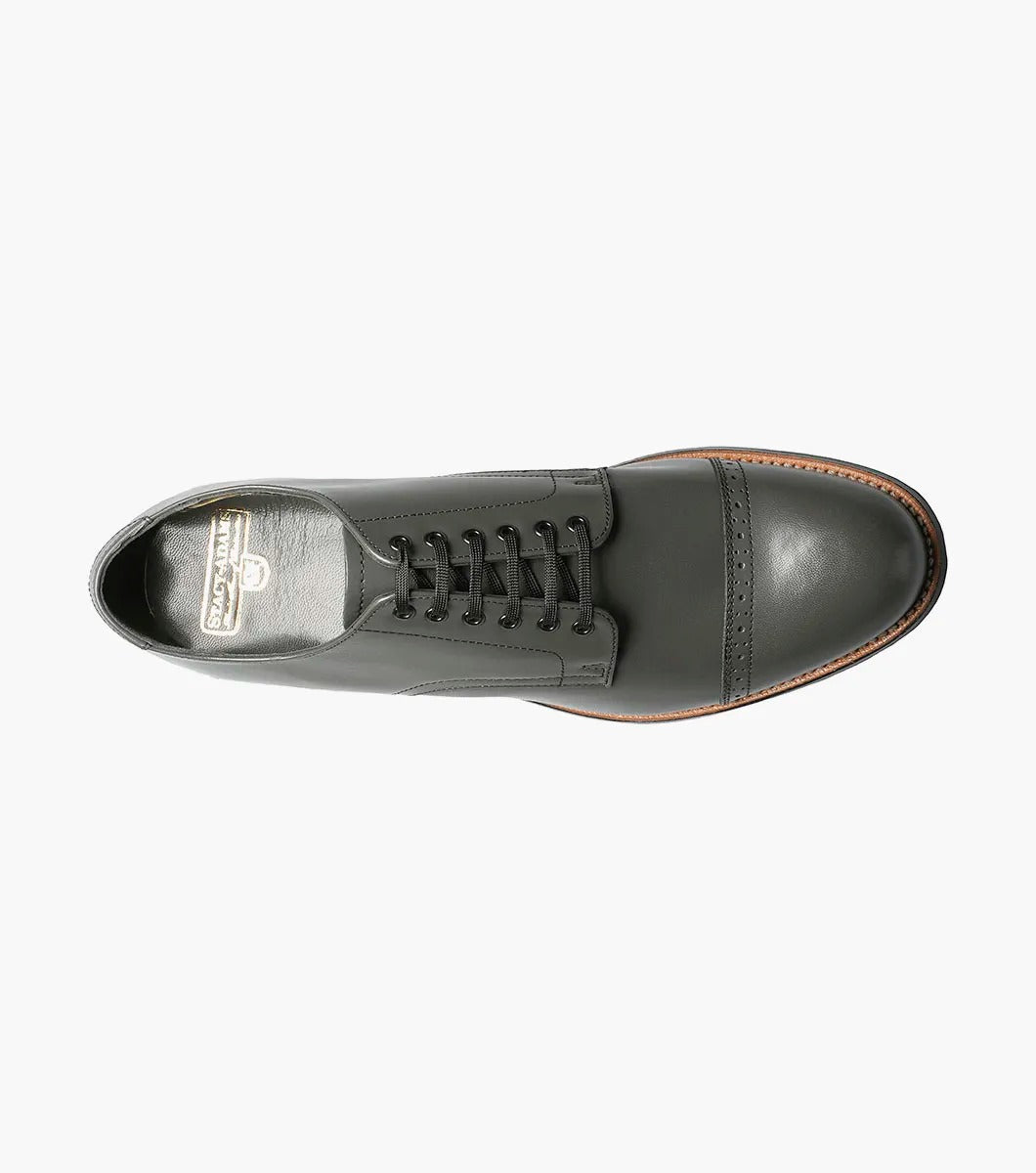 A side view of the Stacy Adams MADISON Cap Toe Oxford in steel gray, crafted from kidskin leather, featuring a cap-toe design with laces and Goodyear welt construction.