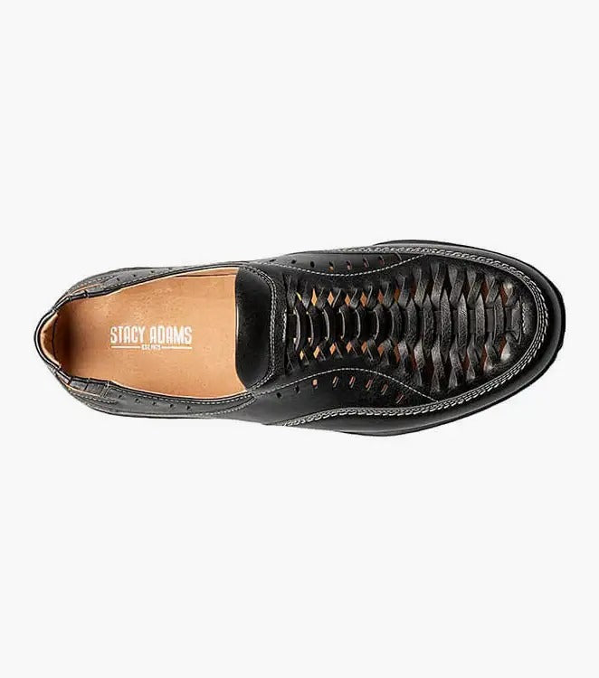 The Stacy Adams IBIZA Woven Vamp Moc Toe Slip On in black (model 25440-001) showcases a cushioned footbed for enhanced comfort. With its closed toe and open heel design, this slip-on sandal is completed with a lightweight EVA sole, making it ideal for everyday wear.