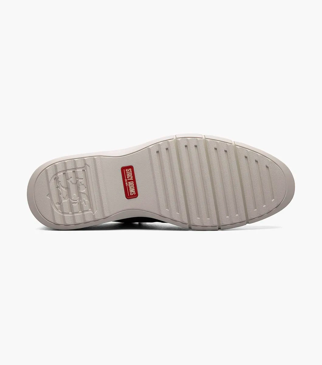 The Stacy Adams SYNCHRO Plain Toe Elastic Lace Up shoe in navy boasts a perforated pattern and a red pull tab, complemented by a light gray sole. It is designed with the RedZone removable footbed to provide anatomical arch support.