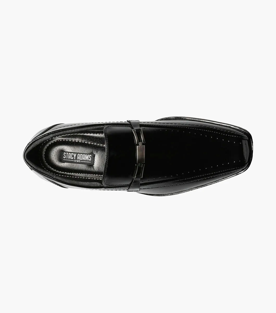 The Stacy Adams CADE Bike Toe Slip On in black, model 20126-001, is a stylish black leather loafer with a slip-on design. It features a gunmetal bit and a low heel, set against a plain white background.