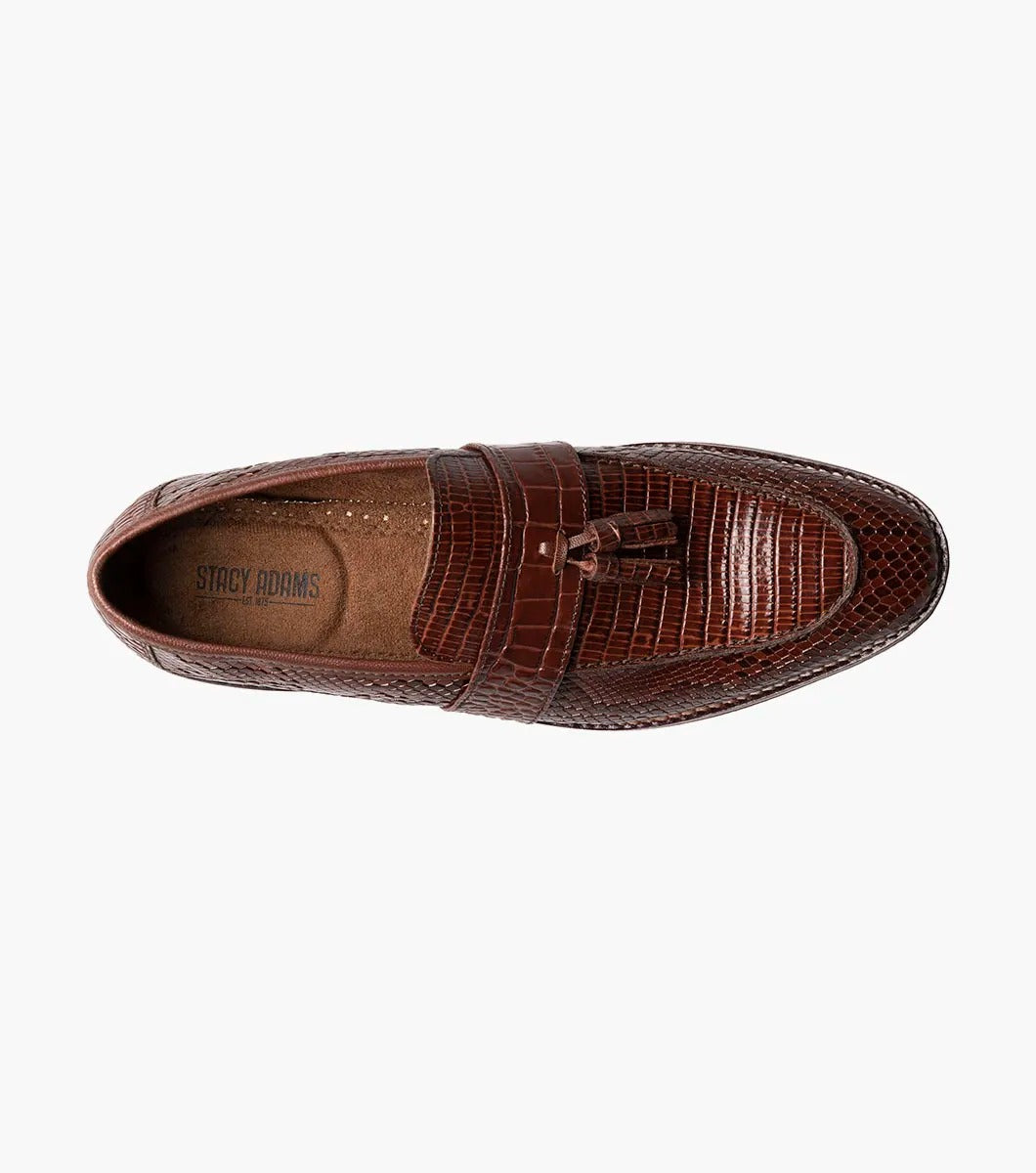 The Stacy Adams - PACETTI Leather Sole Moc Toe Tassel Slip On in Cognac, featuring a textured pattern with tassels on the front and a comfortable memory foam insole, is displayed against a plain white background.