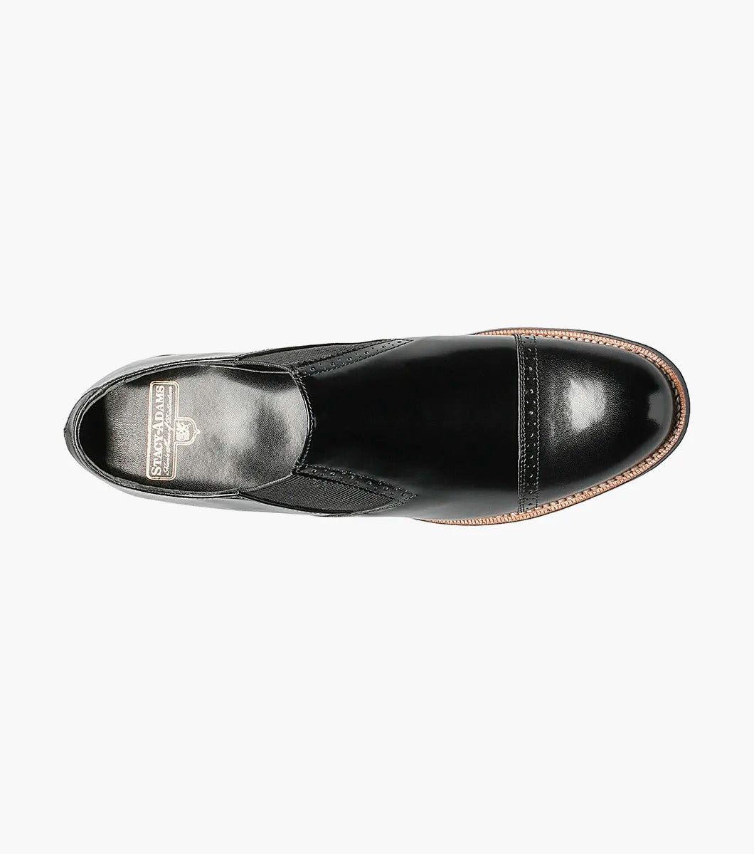 Introducing the Stacy Adams - MADISON Cap Toe Slip On, a sleek black kidskin leather dress shoe with a cap toe design and elastic side panels, presented against a white backdrop.