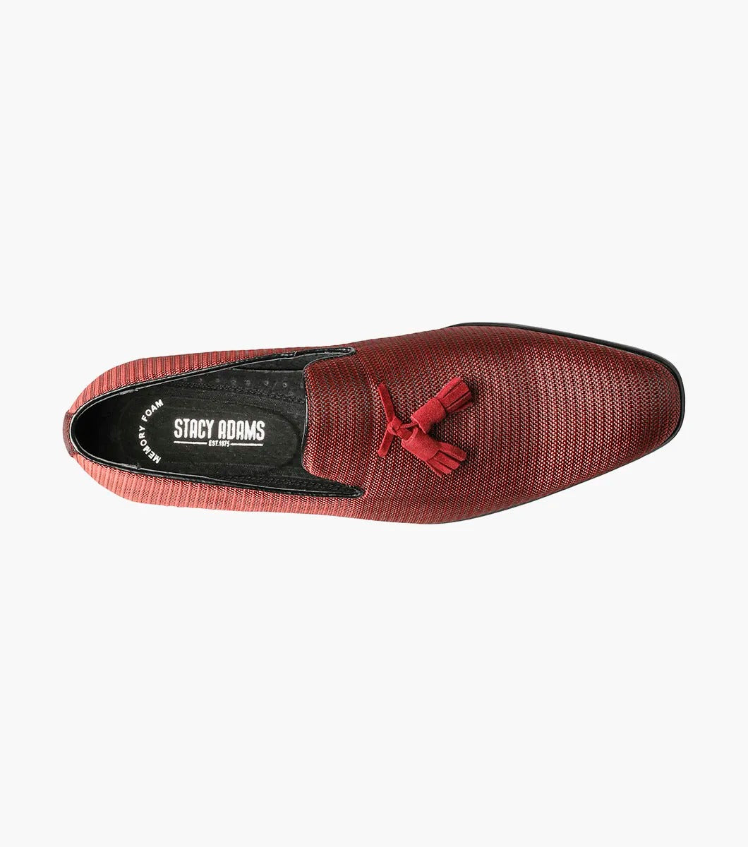 Introducing the Stacy Adams - Tazewell Plain Toe Tassel Slip On in Brick, characterized by its red textured design, black trim, and tassels on top. It features a fully cushioned footbed for ultimate comfort.