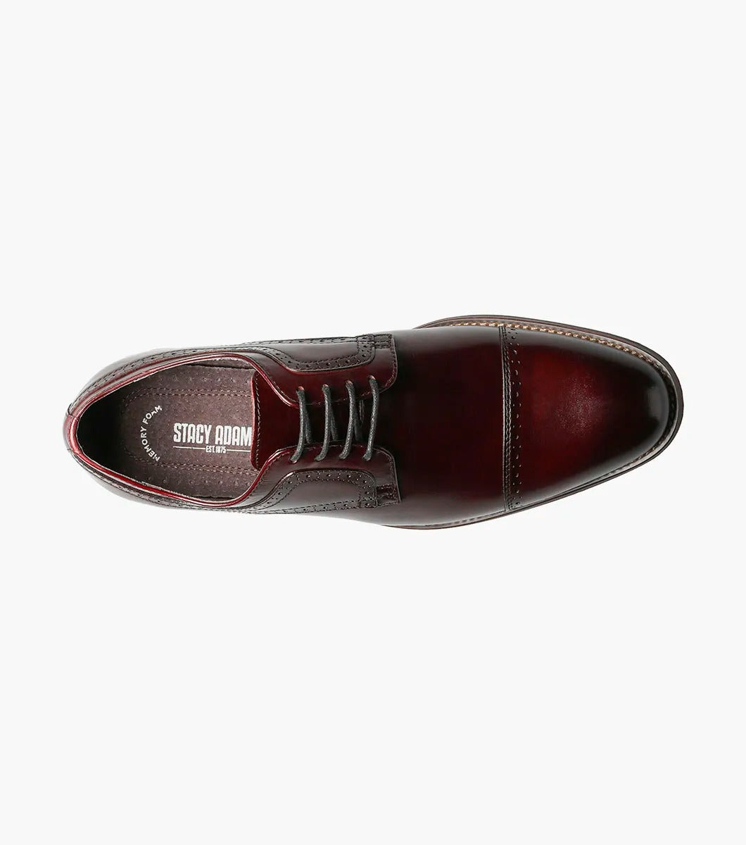 The Stacy Adams DICKINSON Cap Toe Oxford in Burgundy, style number 25066-601, is a classic leather dress shoe from STACY ADAMS. It features laces and decorative stitching and is enhanced with memory foam for ultimate comfort, set against a white background.