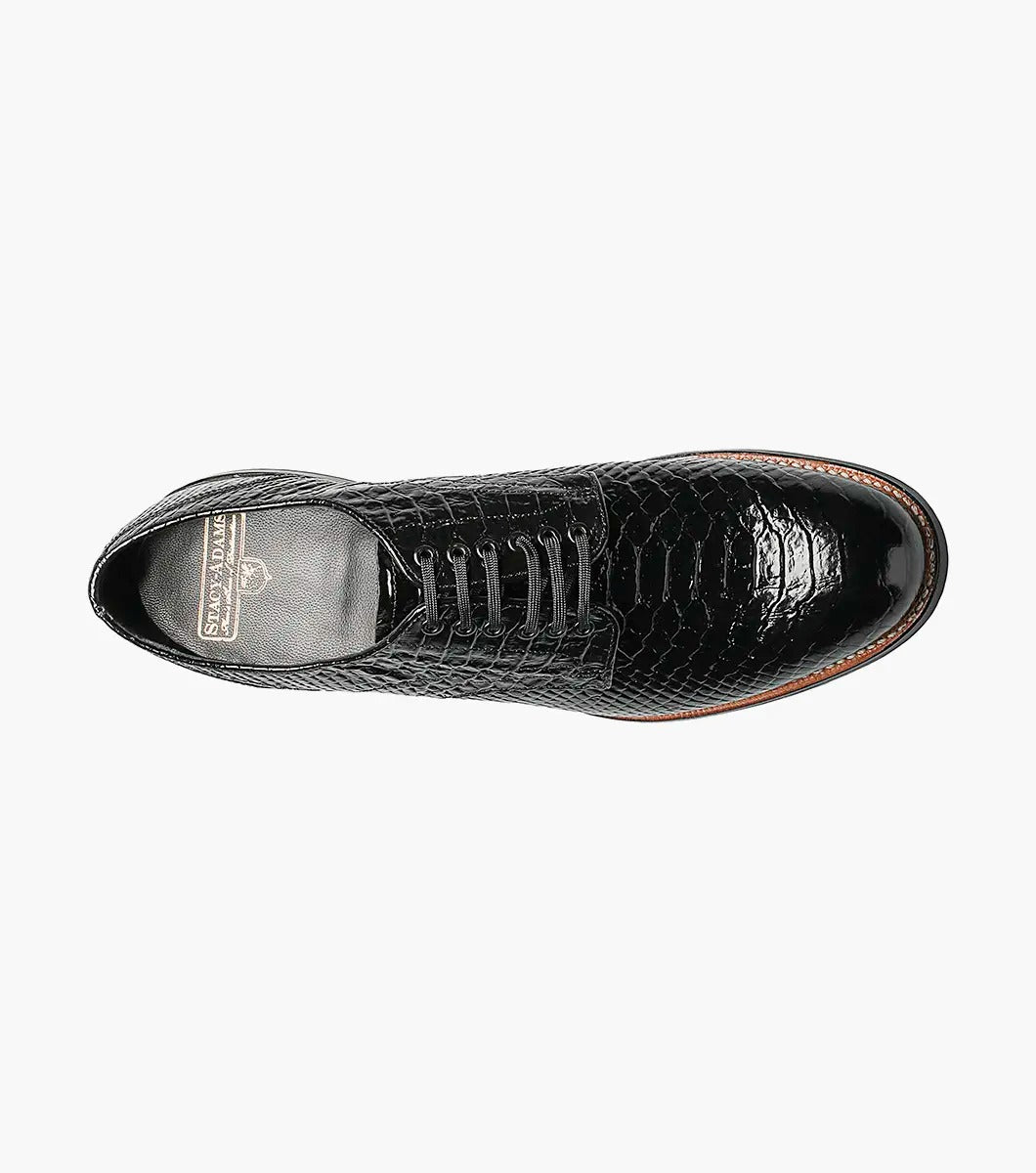 The Stacy Adams - MADISON Anaconda Plain Toe Oxford in black, designed by STACY ADAMS, is a glossy dress shoe with an anaconda print and laces, shown on a white background.