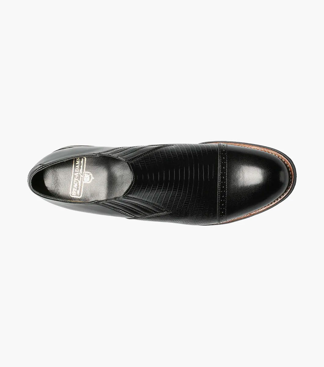 Stacy Adams' MADISON Cap Toe Slip On in black, model 00067-001, is crafted from premium kidskin leather and features textured detailing with a glossy finish.