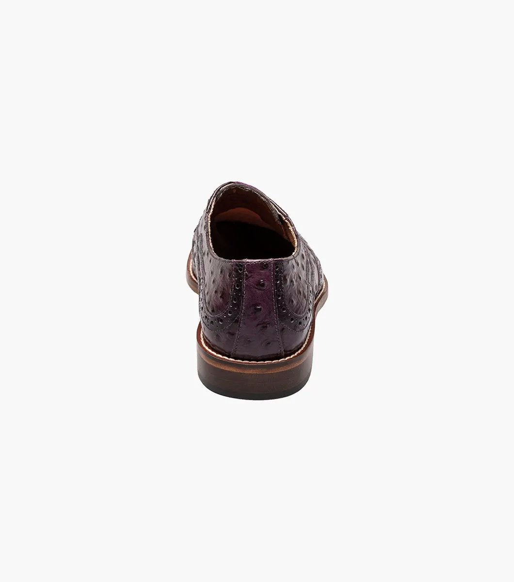 A plum Stacy Adams GENNARO Wingtip Oxford, skillfully crafted from genuine leather with an attractive ostrich quill print texture and featuring a low wooden heel.