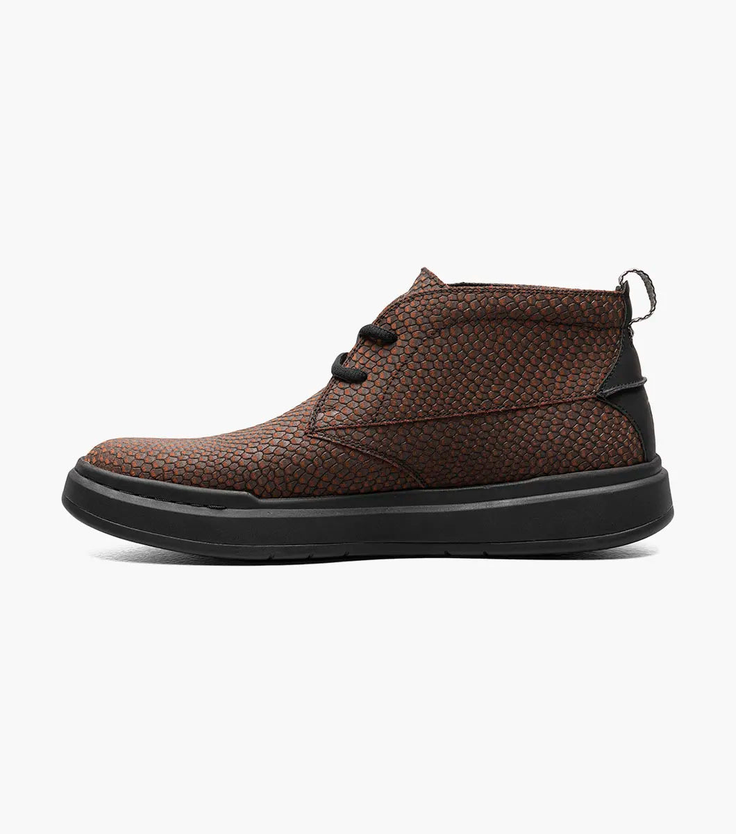 Stacy Adams - CAI Plain Toe Chukka Boot in brown, product code 25566-200, showcases a textured design with a black sole and is photographed on a white background. The boot includes a cushioned insole for enhanced comfort.