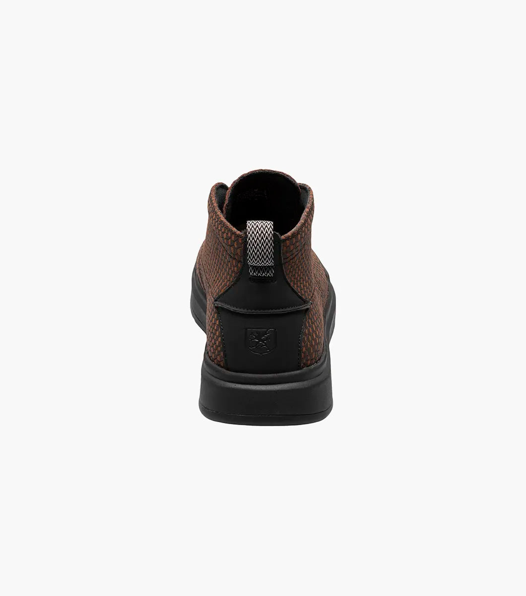 Stacy Adams - CAI Plain Toe Chukka Boot in brown, product code 25566-200, showcases a textured design with a black sole and is photographed on a white background. The boot includes a cushioned insole for enhanced comfort.