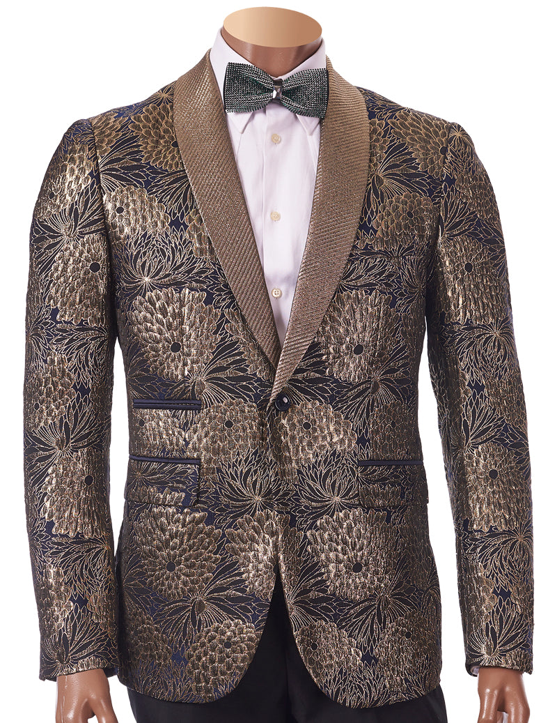 A mannequin is dressed in the Inserch EZX Young Slim Fit Blazer 5519-38 Gold, featuring an elaborate gold and black floral pattern with a shawl collar, paired with a white shirt and bow tie. This blazer is only available in size small.
