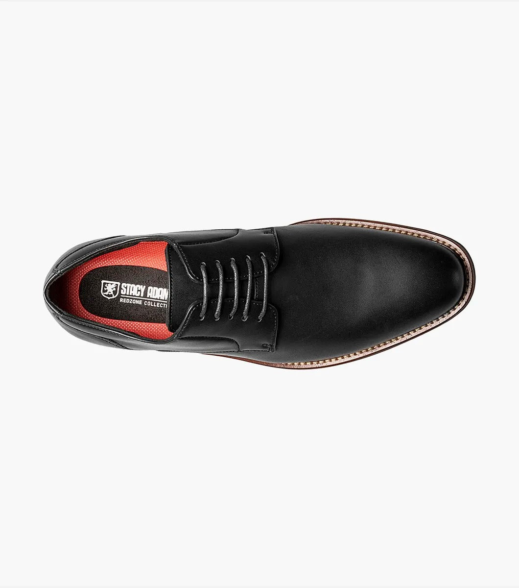 A single Stacy Adams - MARLTON Plain Toe Oxford in black leather, featuring laces, a burnished finish, brown sole, slight heel, and anatomical arch support is displayed on a plain white background.