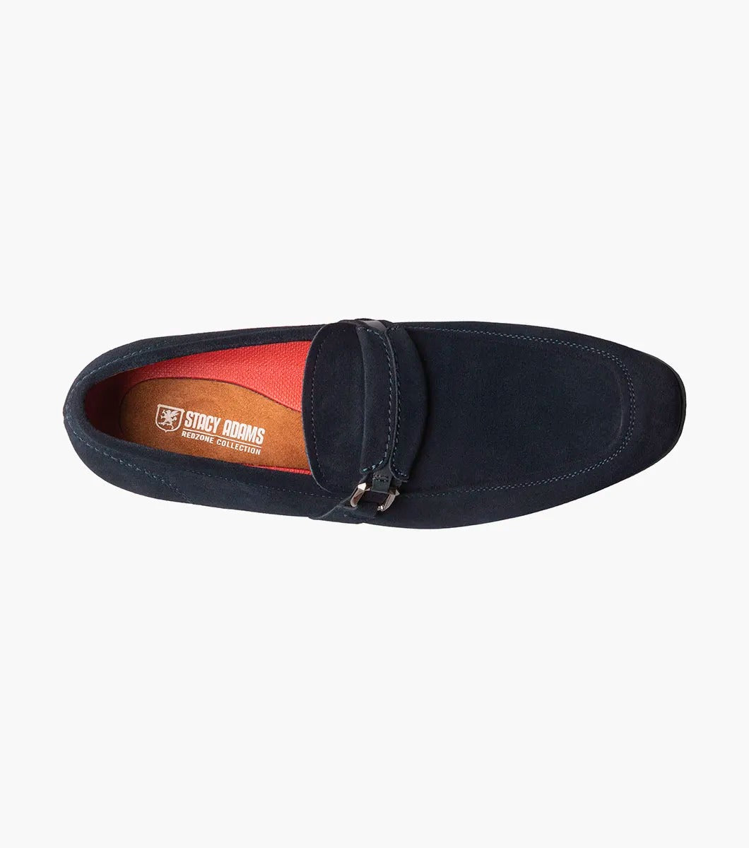 The Stacy Adams - QUILLAN Moc Toe Ornament Slip On features navy suede with a durable rubber outsole, embellished with a small metal buckle and complemented by a low black heel.