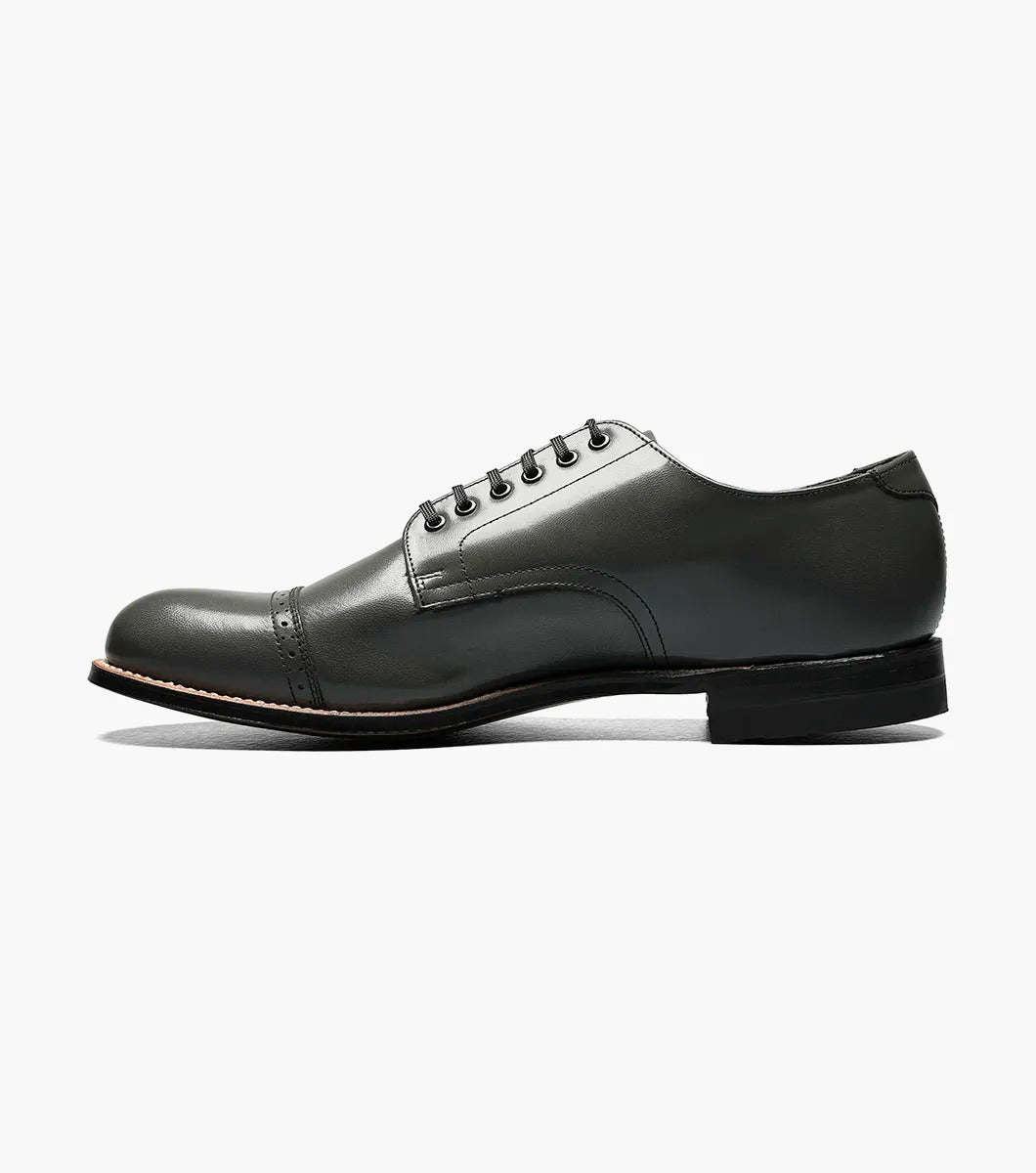 A side view of the Stacy Adams MADISON Cap Toe Oxford in steel gray, crafted from kidskin leather, featuring a cap-toe design with laces and Goodyear welt construction.