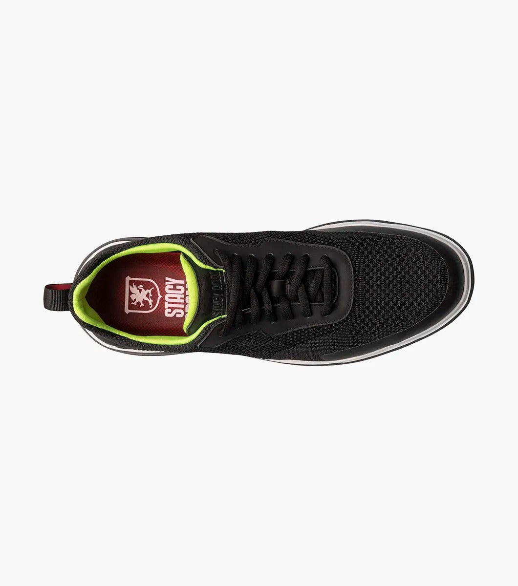 Introducing the Stacy Adams - MAXSON Moc Toe Lace Up Sneaker in black (25517-001) by STACY ADAMS. This stylish sneaker showcases a mesh upper, complemented by a vibrant green interior and a crisp white midsole. Designed for comfort, it features an athletic sole for an easy stride, along with a handy heel pull-tab and coordinating black laces.