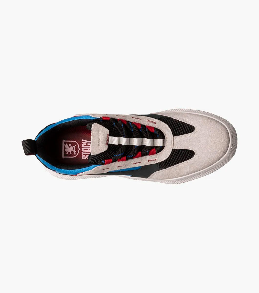 The Stacy Adams Ventura T-Toe Lace Up Sneaker in Chalk Blue Multi (25514-129) from STACY ADAMS boasts a woven black upper with mesh detailing and beige, black, blue, and red accents, along with a white RedZone Footbed.