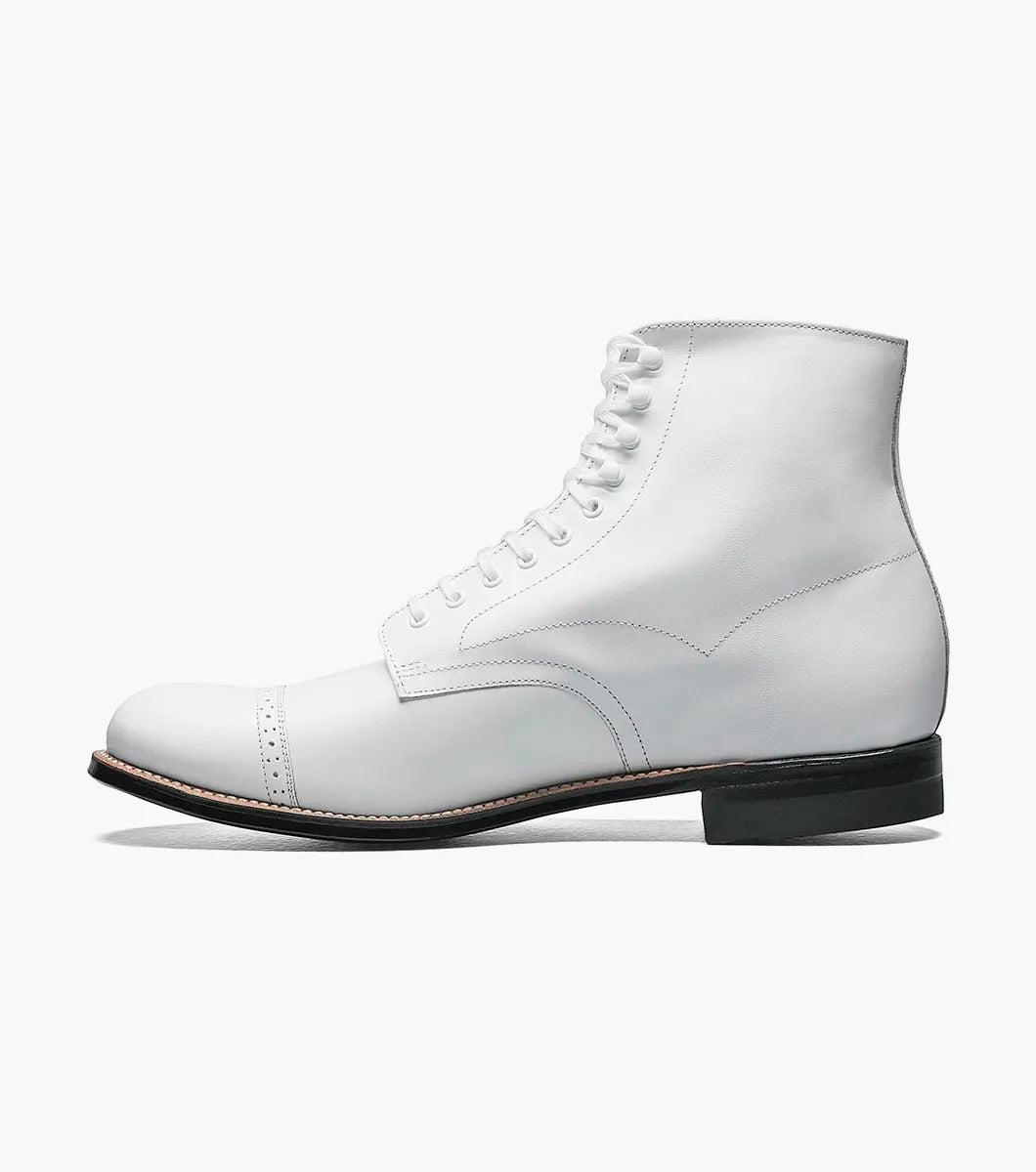 The Stacy Adams MADISON Cap Toe Boot in white is a kidskin leather lace-up boot with a cap toe and black sole, designed using Goodyear welted construction for long-lasting durability.