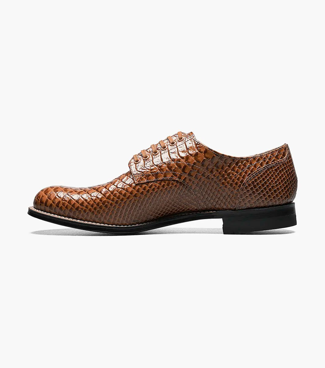 The Stacy Adams - MADISON Anaconda Plain Toe Oxford in tan showcases a lace-up design with a textured anaconda print on brown leather, genuine welt construction, and is complemented by a black sole.