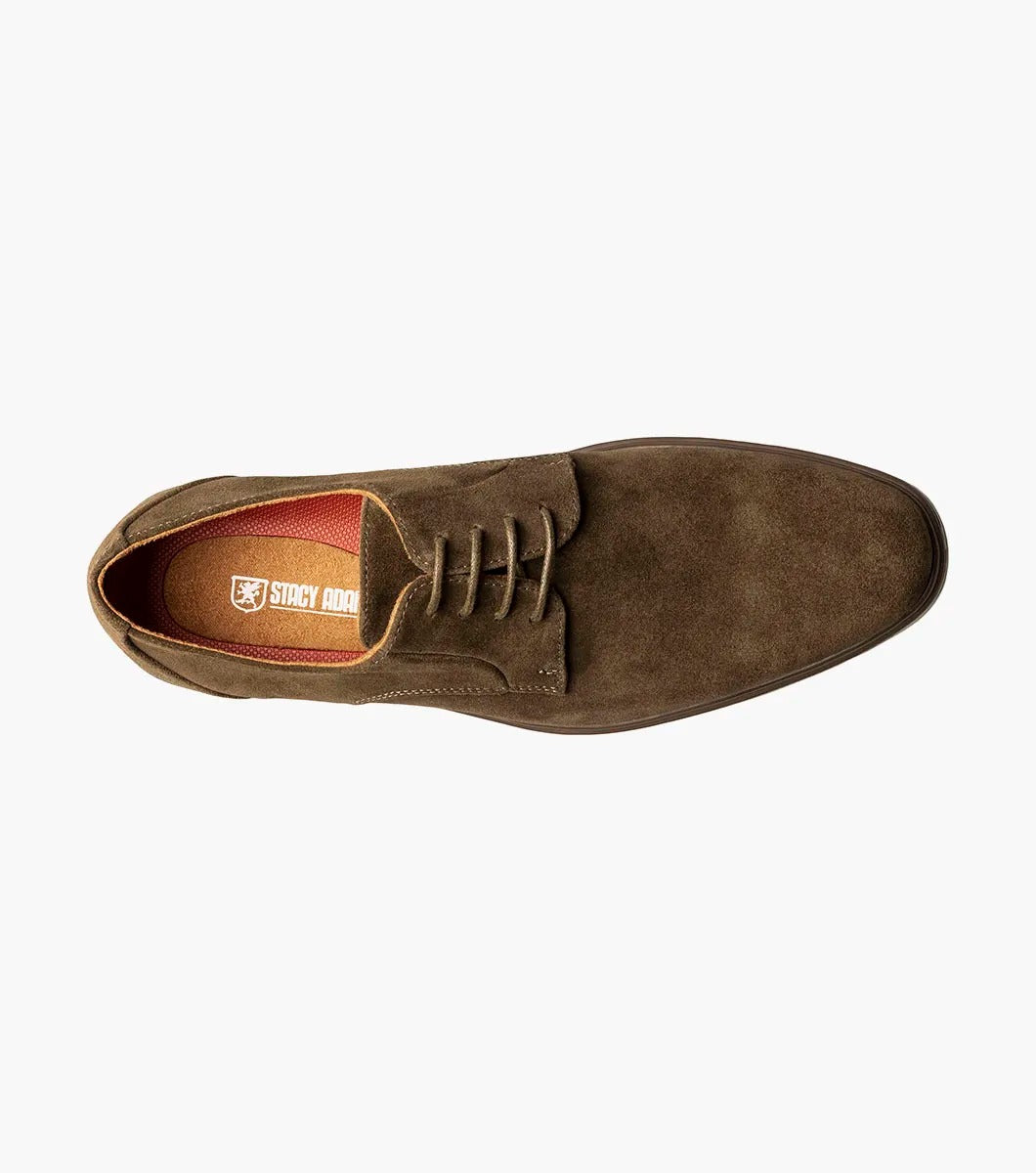 Product: STACY ADAMS presents the TAYSON Plain Toe Lace Up, model 25522-245, featuring a brown suede exterior with a light beige sole and anatomical arch support. This shoe offers a round toe design and laced closure for added comfort and style.