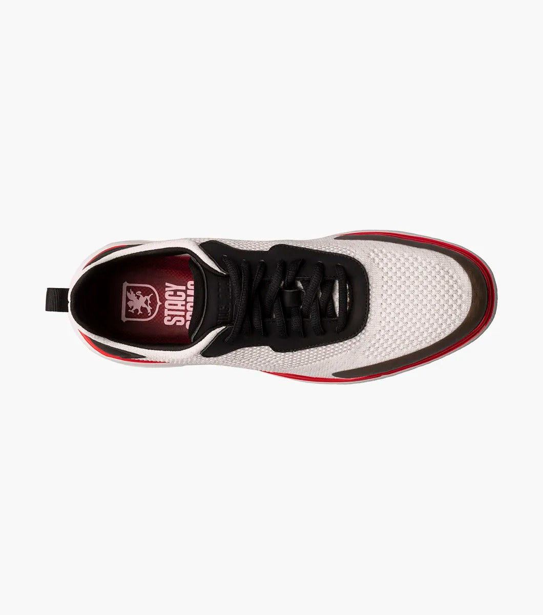 The Stacy Adams - MAXSON Moc Toe Lace Up Sneaker in White Multi (style 25517-110) showcases a sleek design with black accents, a striking red sole, and a distinctive brown toe cap. This hybrid sneaker-casual shoe provides both versatility and comfort, enhanced by the RedZone removable footbed for premium support.