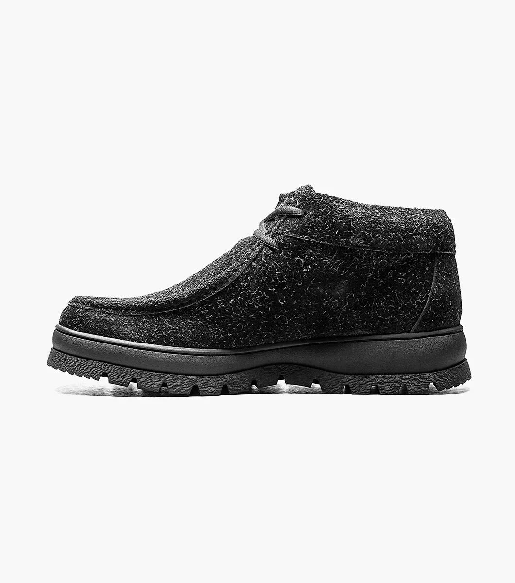 Product Description: The Stacy Adams Dublin II Moc Toe Boot in Black Multi, style number 63169-009, features a textured finish, lace-up front, and a durable rubber outsole. It is showcased against a plain white background.