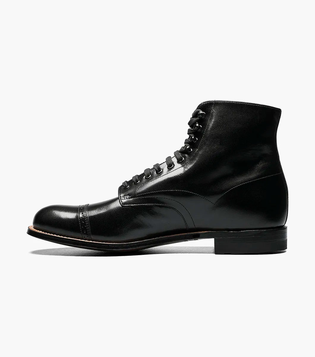 The Stacy Adams MADISON Cap Toe Boot in black, model 00015-01, features a refined design with a polished finish and cap toe. Constructed using Goodyear welt technology, it offers lasting durability and classic style.