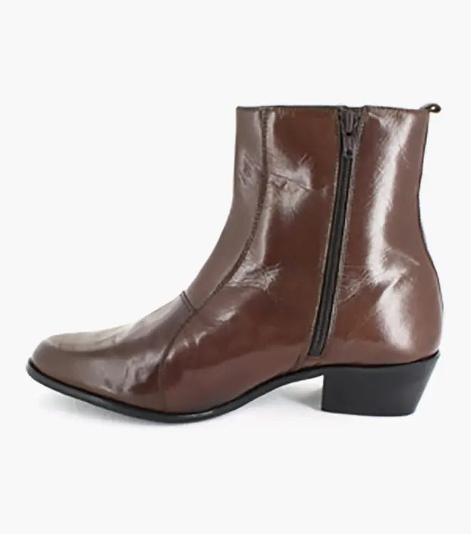 The Stacy Adams - SANTOS Slip On Boot in Cognac, model 24855-221, showcases kidskin leather for a chic combination of comfort and style, complemented by its low heel and sophisticated brown hue.