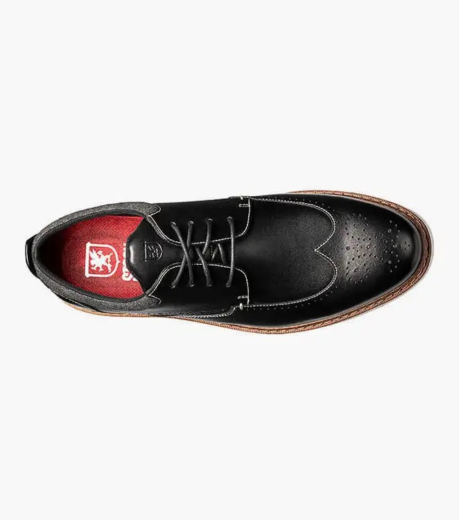 Stacy Adams' SYNERGY Wingtip Oxford in black (25418-001) showcases decorative perforations and a lace-up design, complemented by a contrasting light brown sole and featuring the RedZone footbed for enhanced comfort.