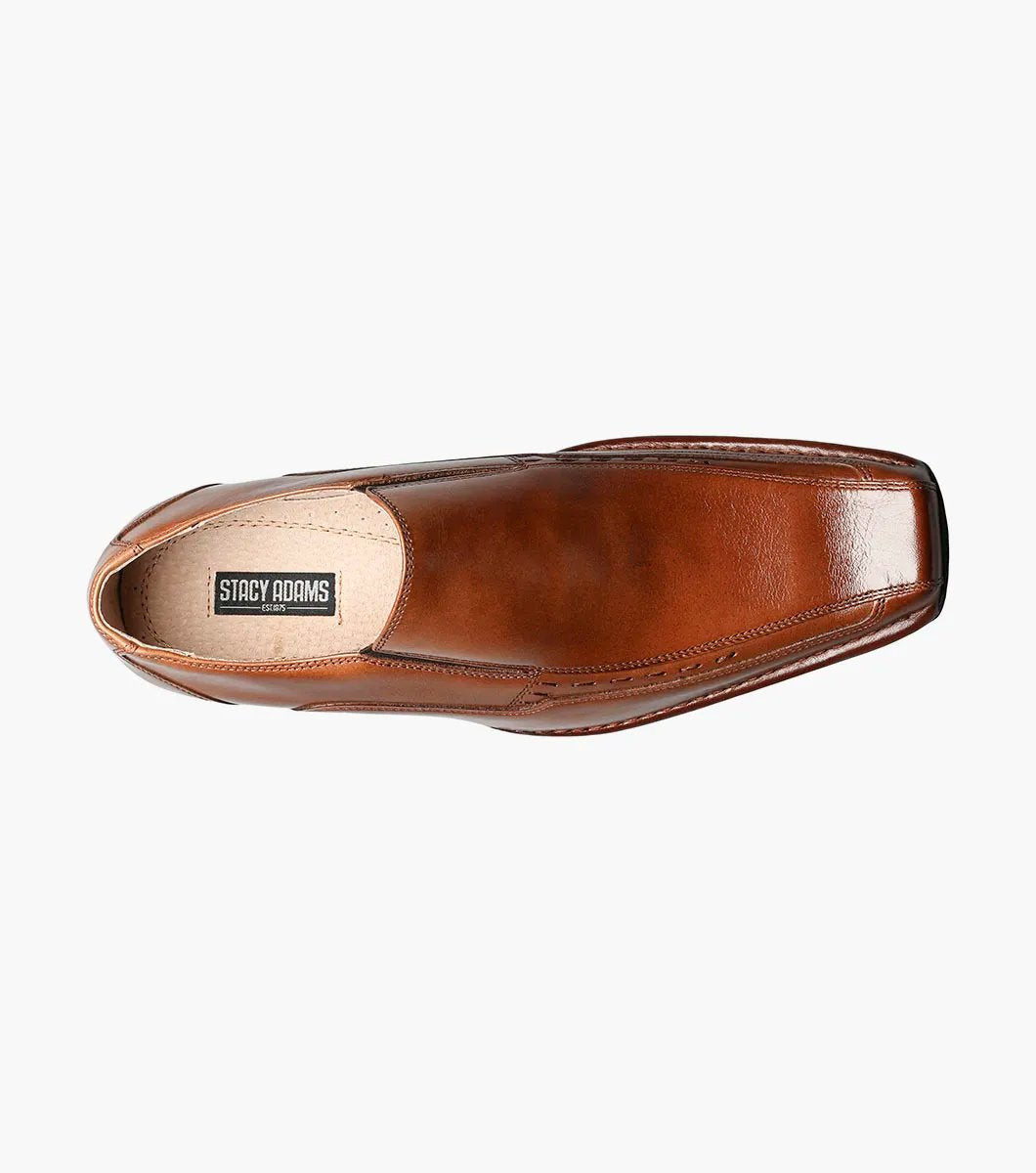 Stacy Adams' TEMPLIN Bike Toe Loafer in cognac showcases a genuine leather design with a stylish pointed toe and subtle stitching detail, set on a black sole. This elegant shoe features a cushioned insole for enhanced comfort, all highlighted against a plain background.