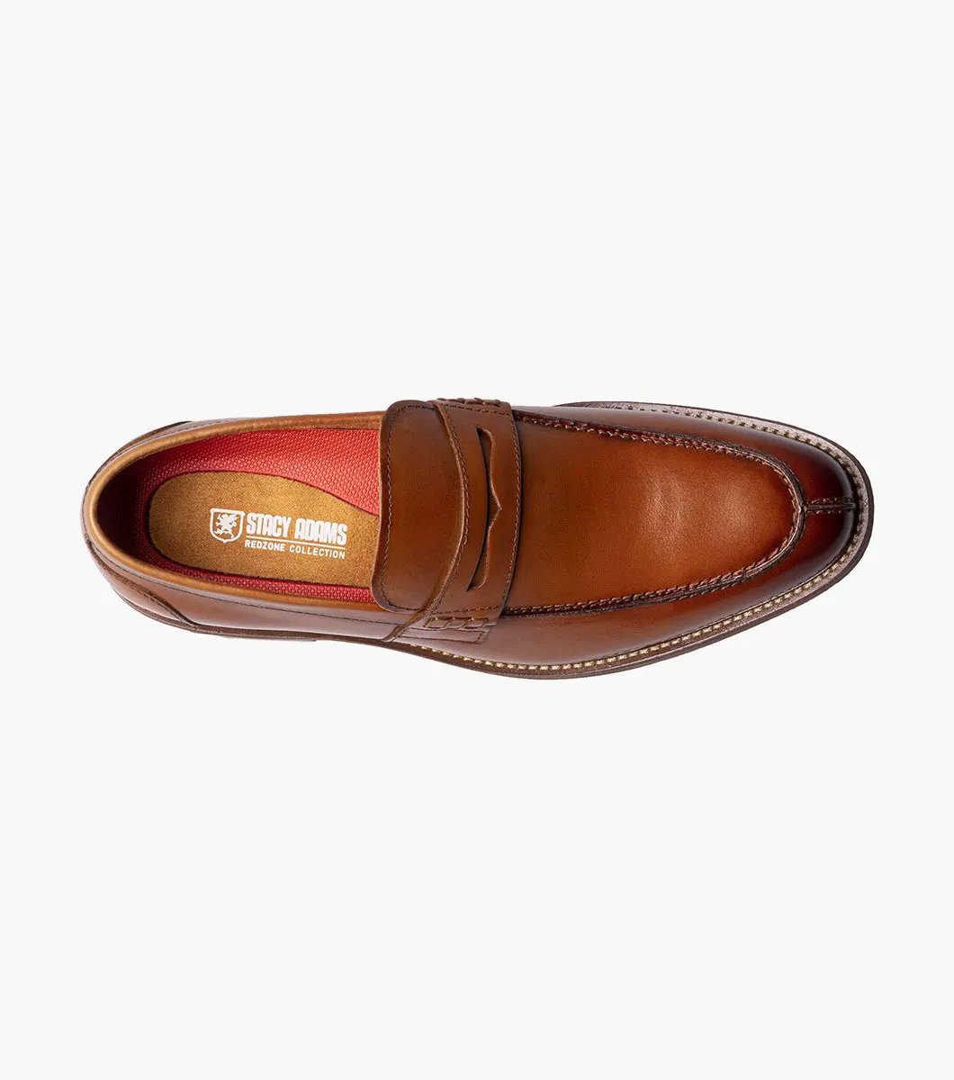 The Stacy Adams - MARLOWE Algonquin Moc Toe Penny Slip On in Cognac, with a leather upper and detailed stitching on a low heel, is showcased against a white background.