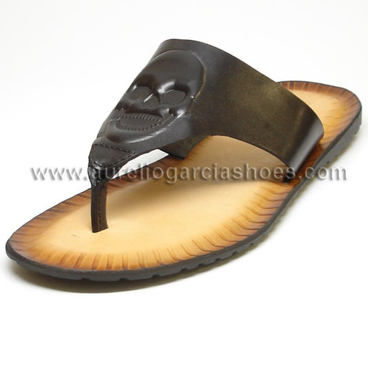 Introducing the FI-4049 Black Encore by Fiesso: a stylish leather sandal with a dark brown strap adorned with a skull design and a light brown sole featuring visible stitching.