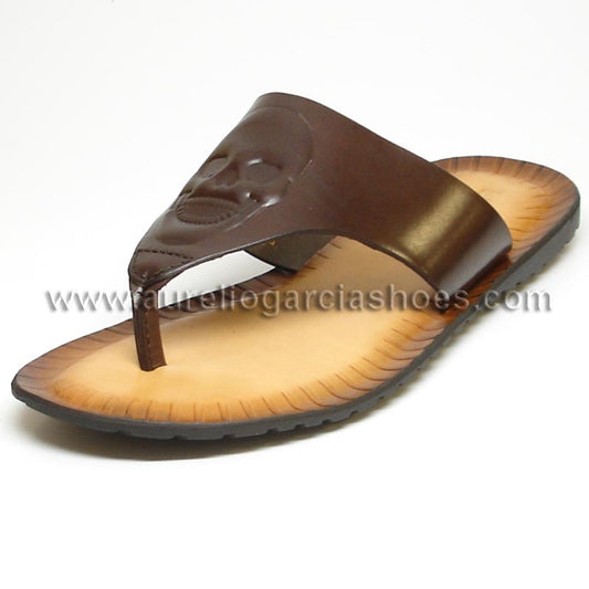 An artfully angled FI-4049 Brown Encore by Fiesso flip-flop sandal showcases a comfortable brown leather design, complemented by a tan sole and a raised pattern on the strap.