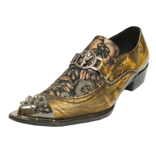 The FI-6847 Brown Fiesso by Aurelio Garcia fashion shoe features a leather upper with gold and brown tones, adorned with metal studs on the toe, an intricate floral pattern, a decorative buckle, and a low heel. This shoe is crafted by the brand Fiesso.