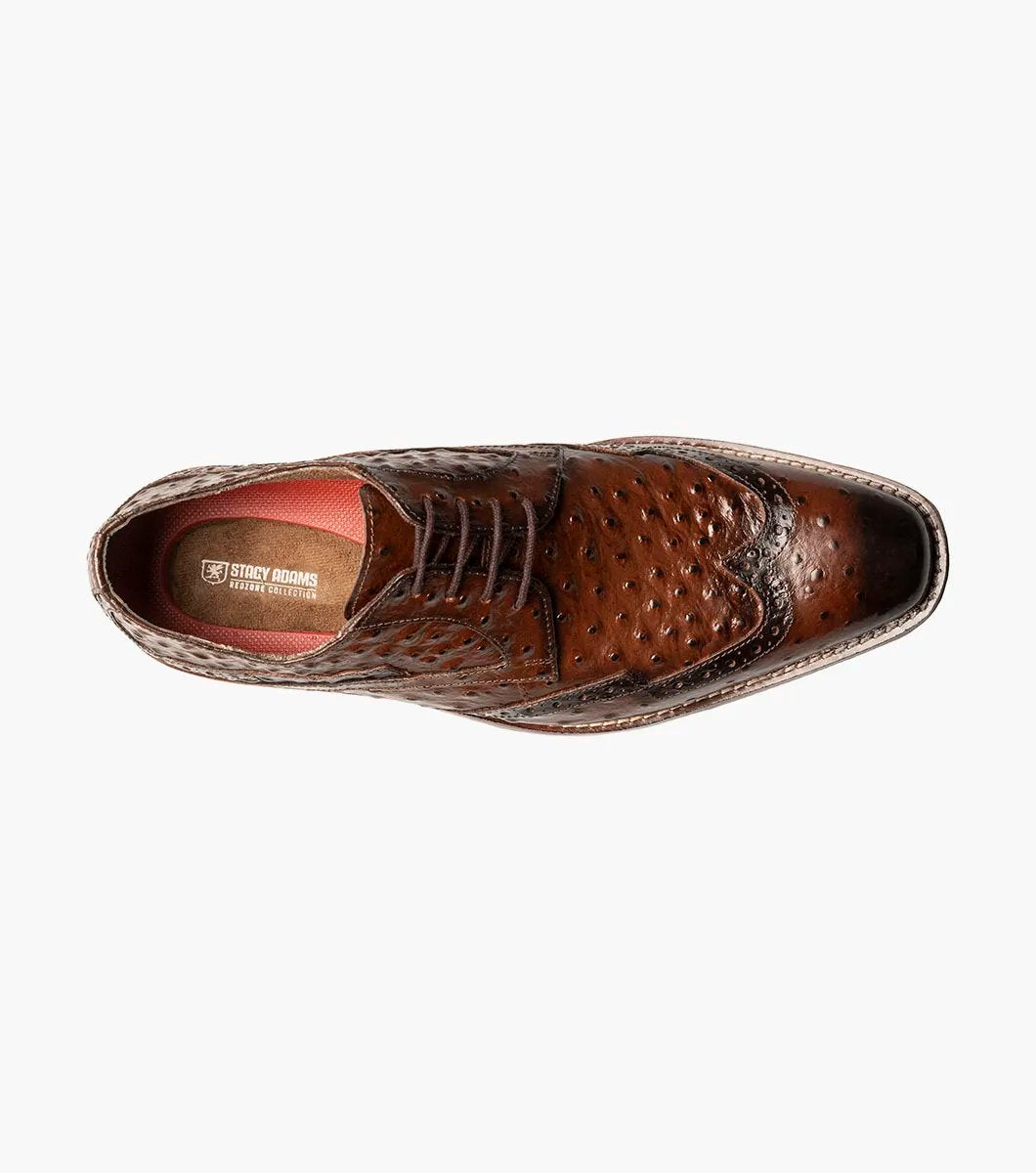 The Stacy Adams GENNARO Wingtip Oxford in cognac showcases a brown ostrich quill print leather design with intricate brogue detailing and a lace-up closure, complemented by anatomical arch support, offering an elegant side view.