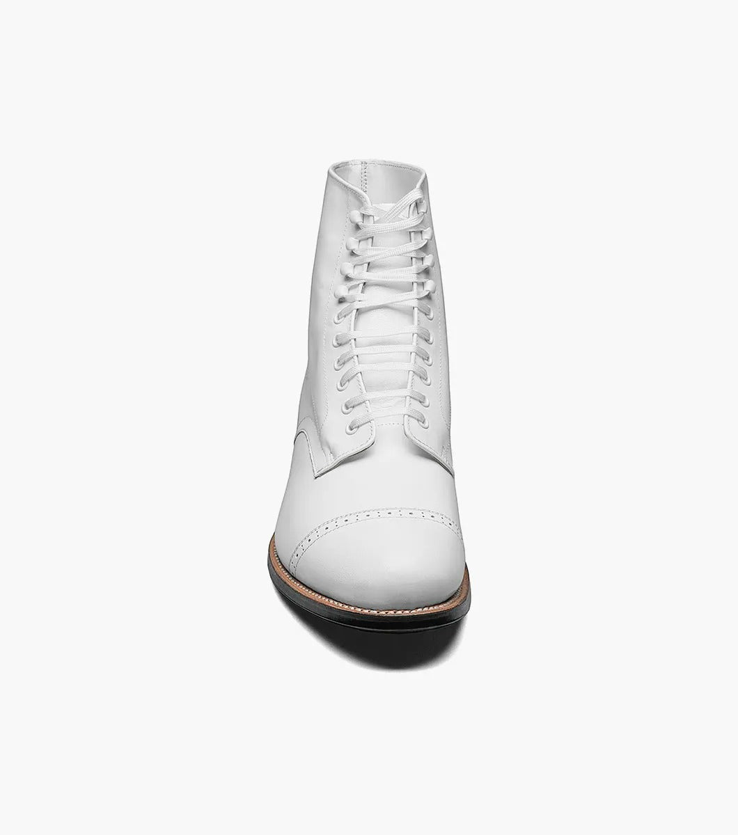 The Stacy Adams MADISON Cap Toe Boot in white is a kidskin leather lace-up boot with a cap toe and black sole, designed using Goodyear welted construction for long-lasting durability.