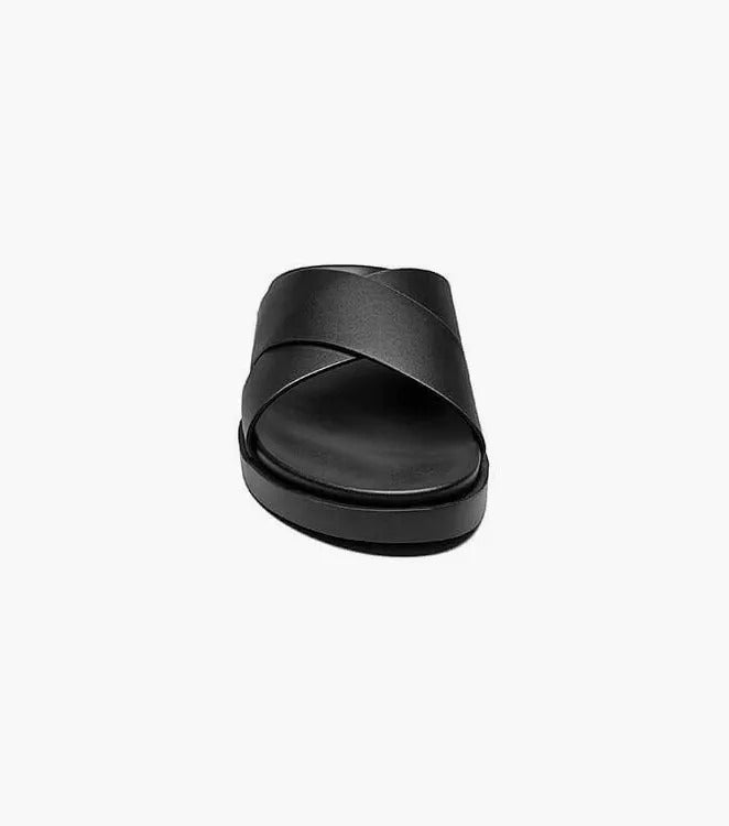 The STACY ADAMS - MONTEL Cross Strap Slide Sandal in Black (Product Number: 25469-001) showcases a sleek design featuring crisscross straps and a comfortable flat sole, complete with a cushioned insole for all-day support.