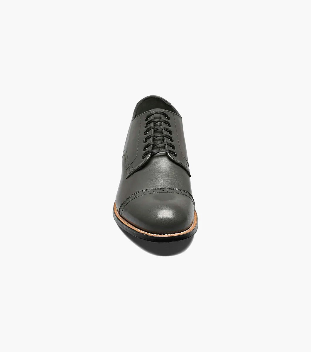 A side view of the Stacy Adams MADISON Cap Toe Oxford in steel gray, crafted from kidskin leather, featuring a cap-toe design with laces and Goodyear welt construction.