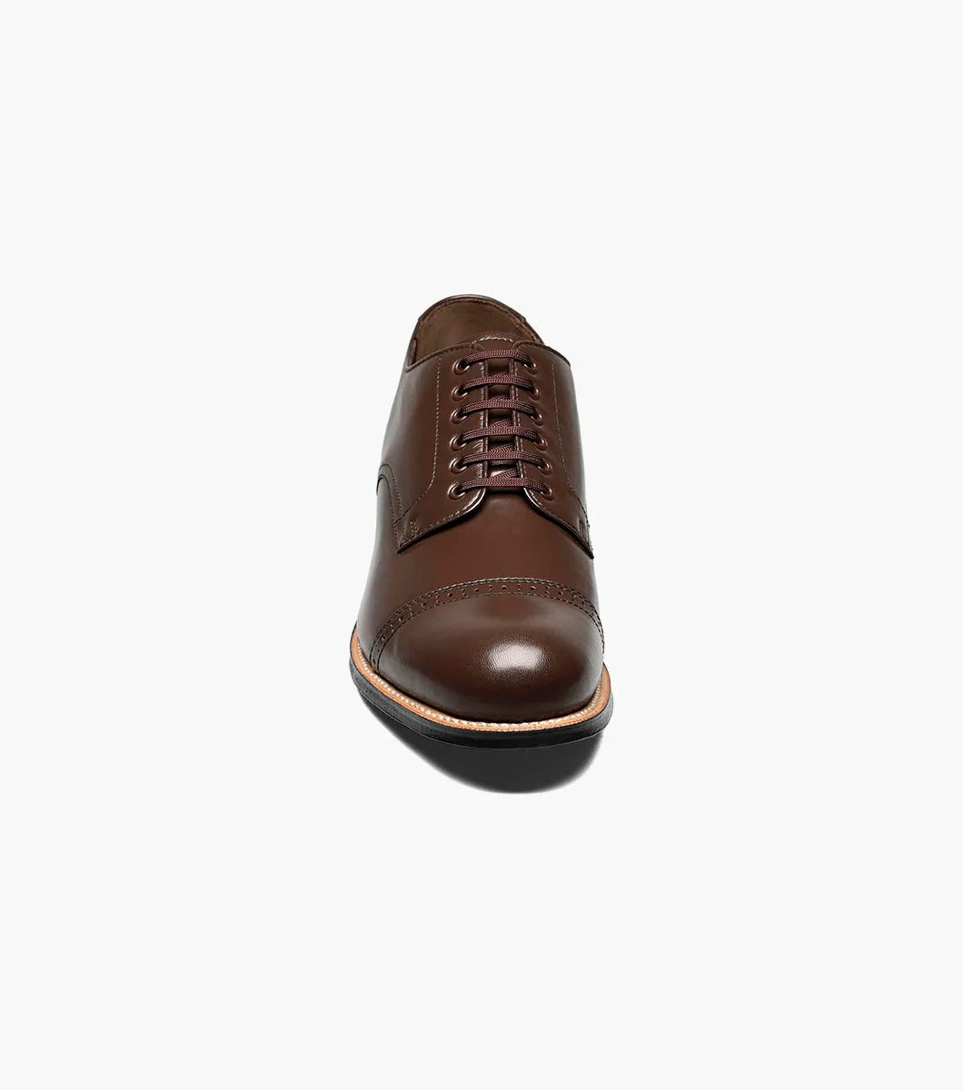 Stacy Adams - MADISON Cap Toe Oxford in luxurious brown kidskin leather, with sleek black laces, gracefully showcased on a white background.