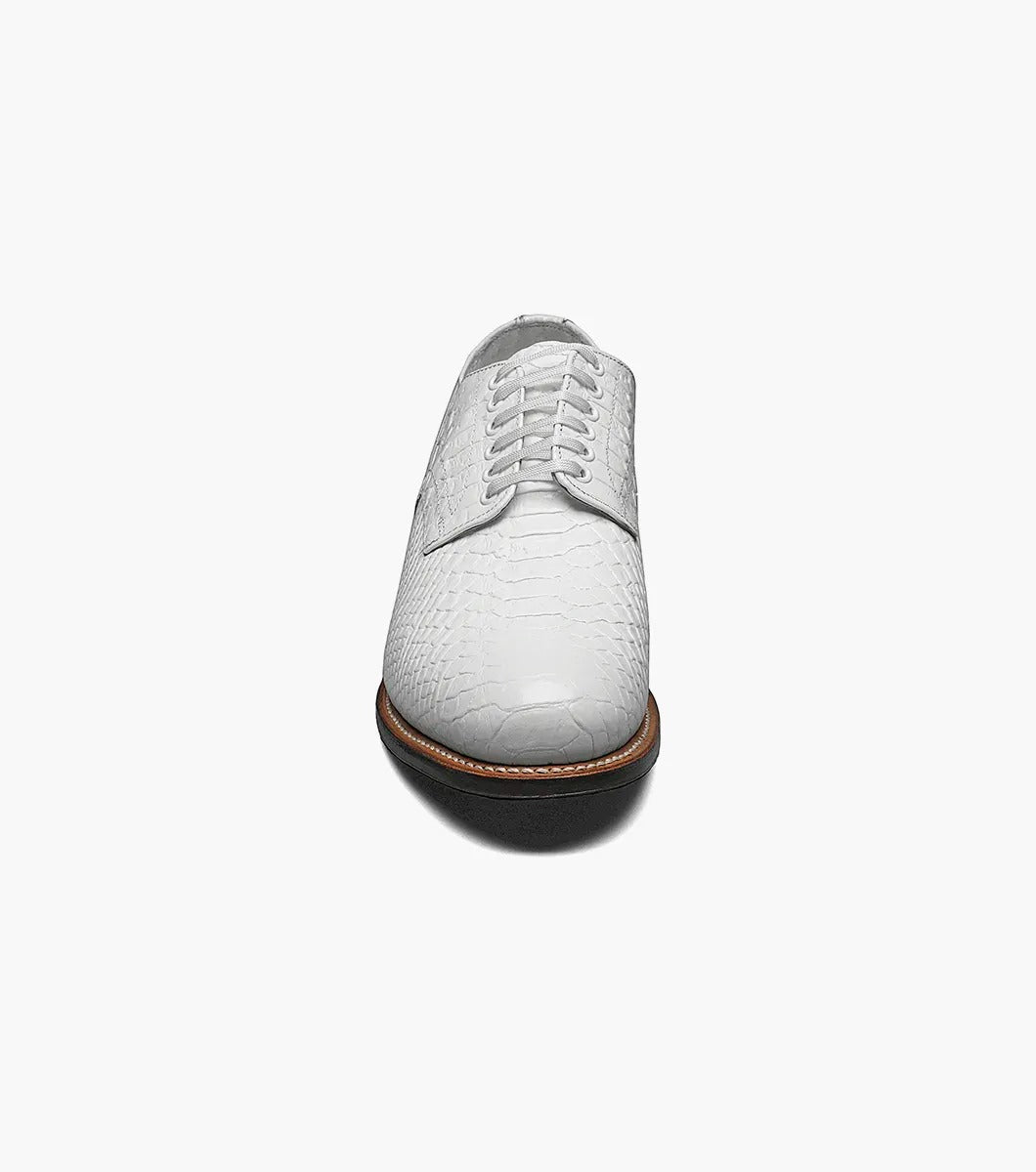 A Stacy Adams MADISON Anaconda Plain Toe Oxford in white, made with textured leather and laces, showcases a low heel and dark sole. It features Goodyear welt construction and is photographed against a white background.