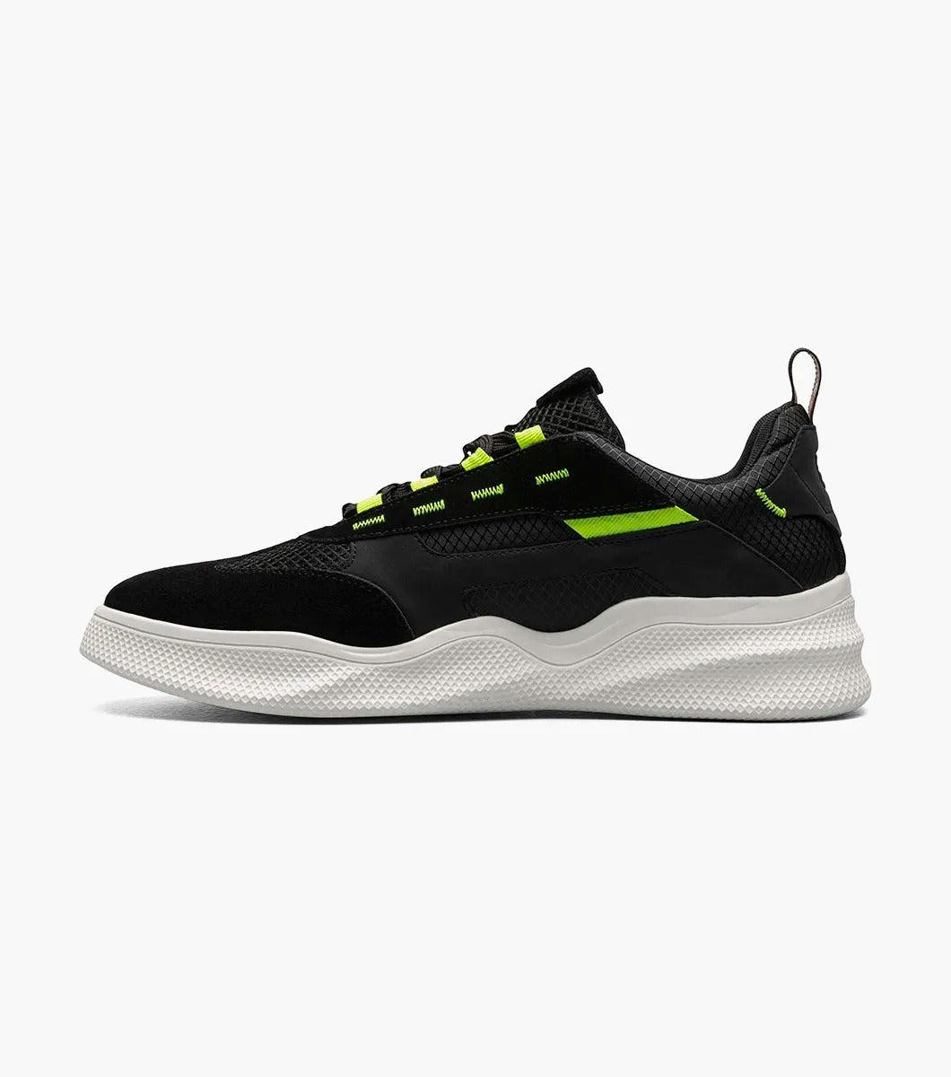 The Stacy Adams Ventura T-Toe Lace Up Sneaker in Black Multi, model 25514-009, combines black and green hues with a white sole for a stylish sneaker design set against a simple backdrop. Crafted for maximum comfort, it incorporates the cutting-edge RedZone removable footbed to make each step feel perfect.