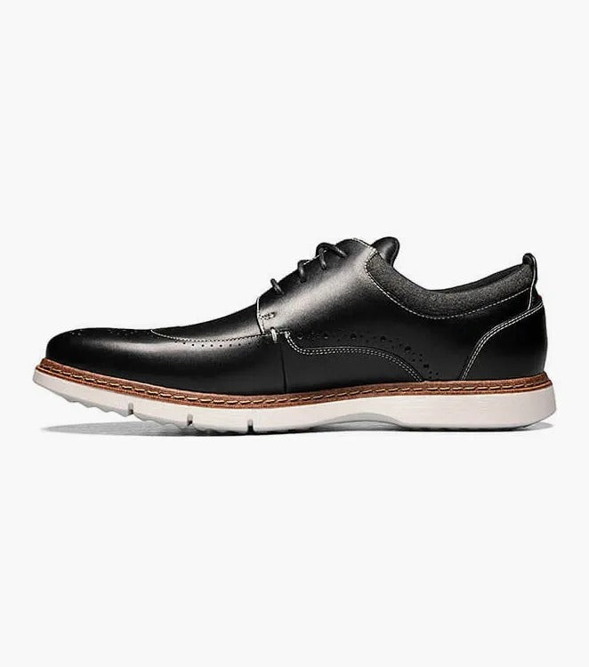 Stacy Adams' SYNERGY Wingtip Oxford in black (25418-001) showcases decorative perforations and a lace-up design, complemented by a contrasting light brown sole and featuring the RedZone footbed for enhanced comfort.