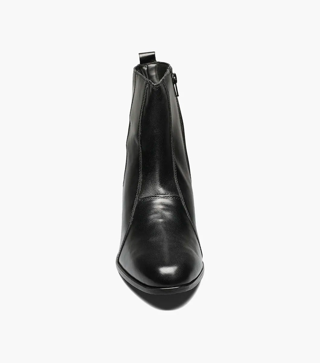 The Stacy Adams - SANTOS Slip On Boot in black showcases a sleek kidskin leather design with a side zipper and a low, angled heel, beautifully set against a white background.