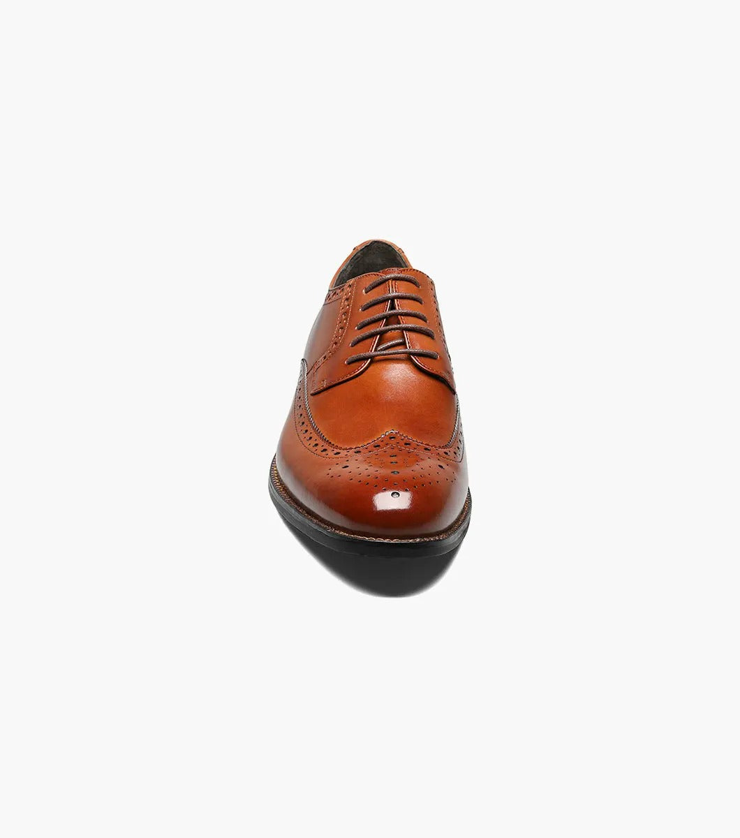 Stacy Adams GARRISON Wingtip Oxford in Cognac, featuring genuine leather with decorative perforations, a black sole, and a cushioned insole for enhanced comfort.