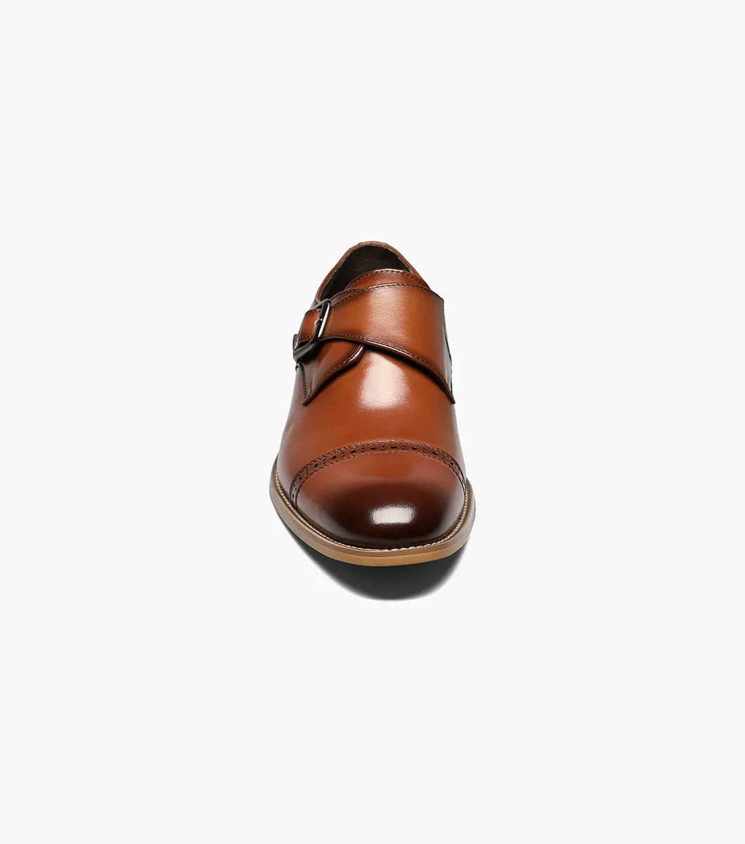 The Stacy Adams DESMOND Cap Toe Monk Strap in cognac combines a buckle, decorative perforations, cap toe detailing, and a wooden heel for a sophisticated look.