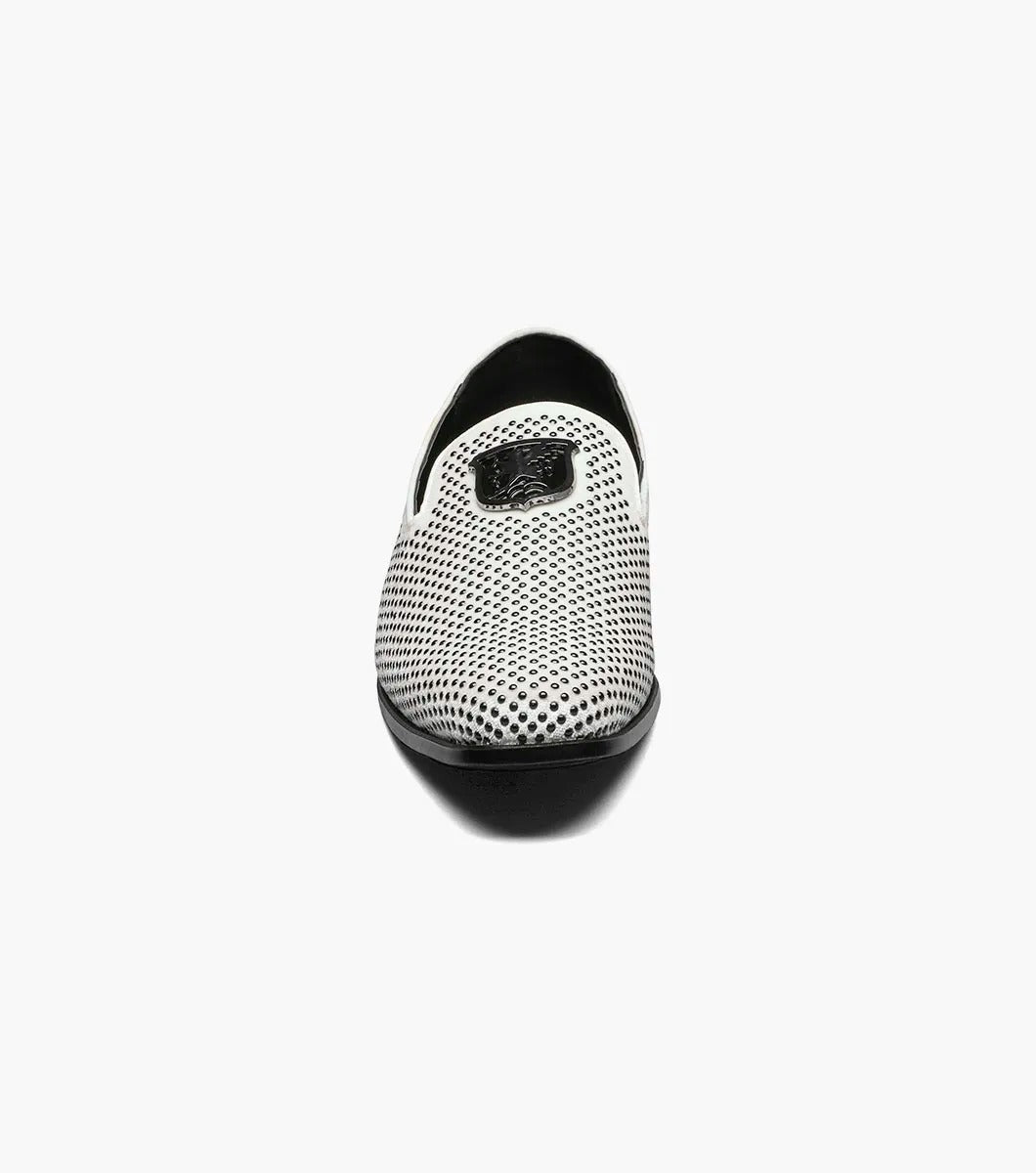 The Stacy Adams - SWAGGER Studded Slip On (Black with White, 25228-111) showcases a striking design with a white studded leather loafer contrasted by a black sole and adorned with a decorative metal emblem on top, offering both style and comfort thanks to its Memory Foam insole.