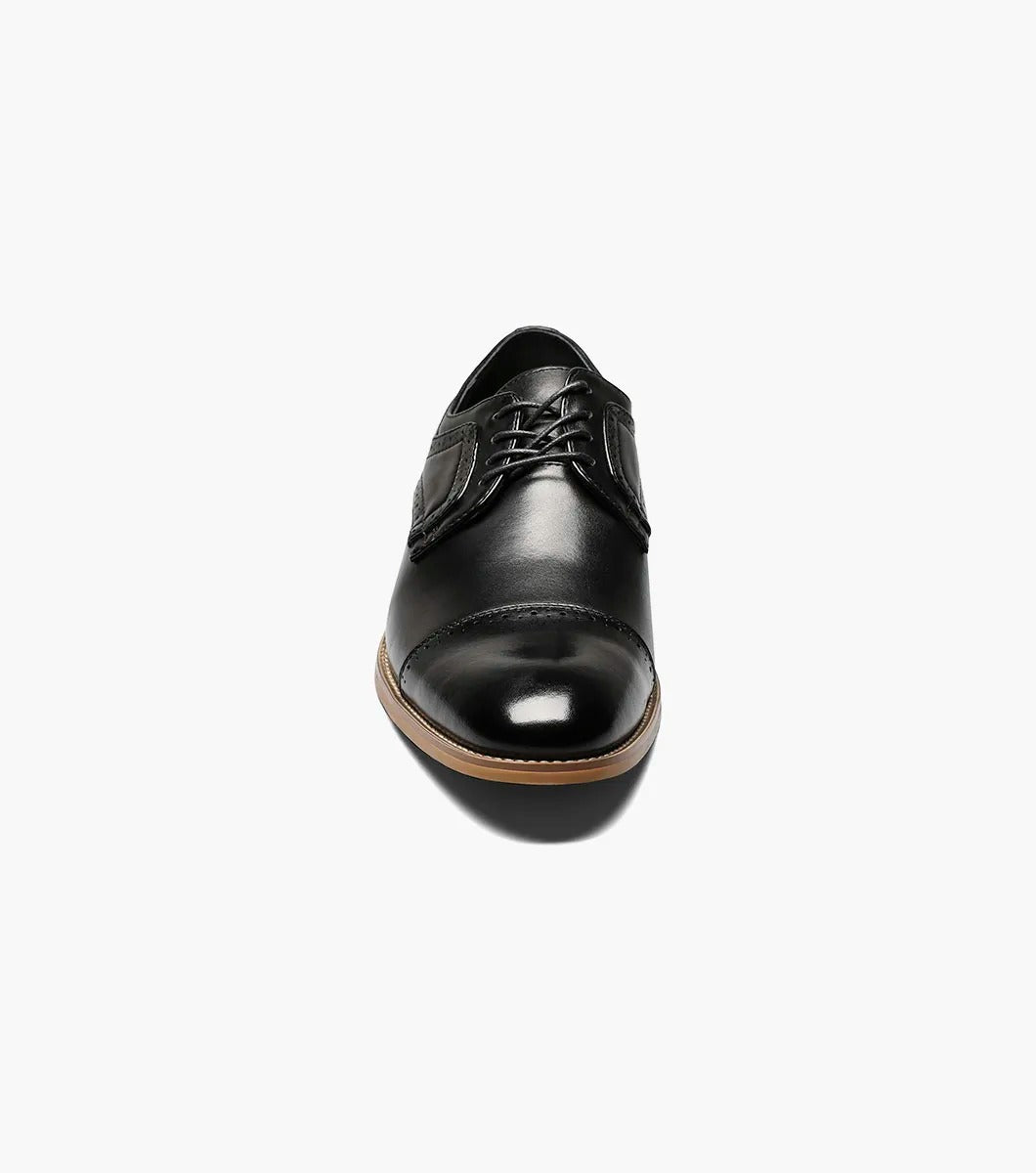 The Stacy Adams DICKINSON Cap Toe Oxford in black features decorative stitching, a brown sole, and a comfortable memory foam insole.