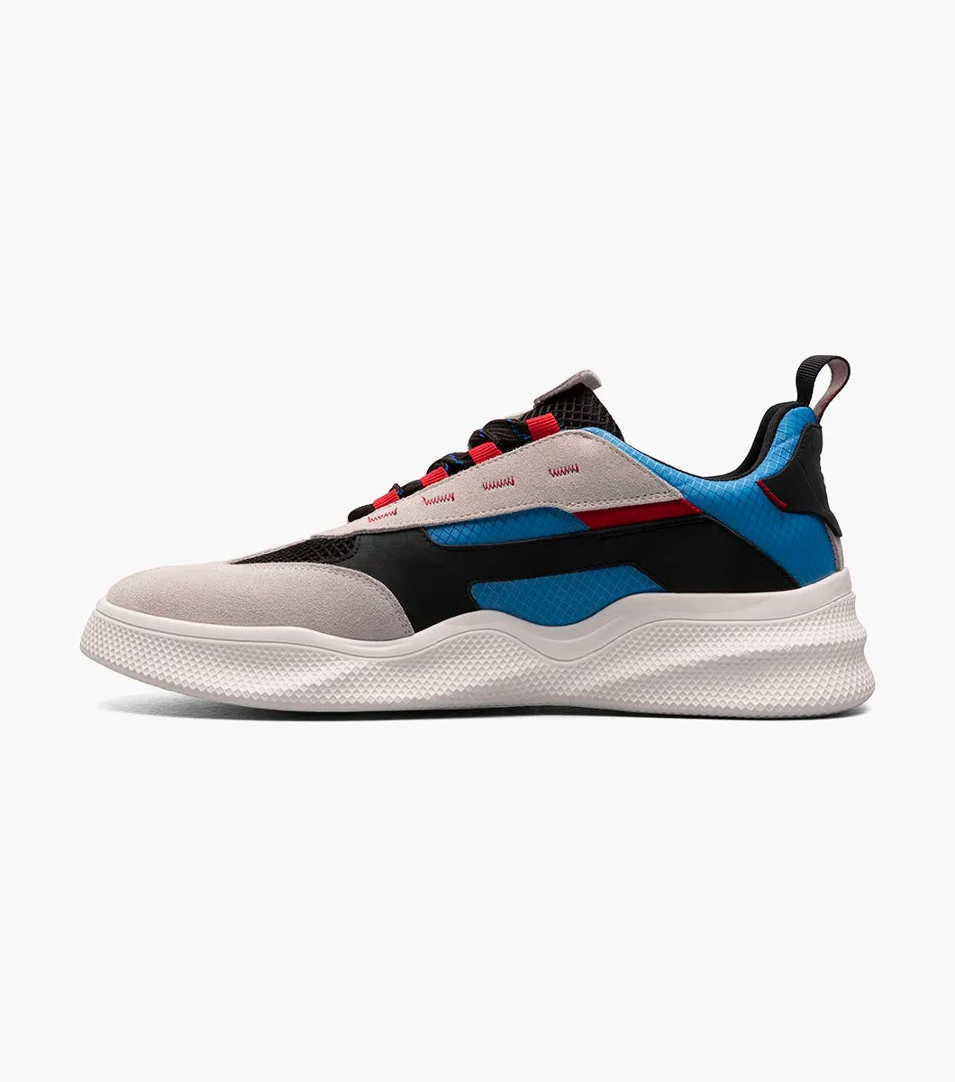 The Stacy Adams Ventura T-Toe Lace Up Sneaker in Chalk Blue Multi (25514-129) from STACY ADAMS boasts a woven black upper with mesh detailing and beige, black, blue, and red accents, along with a white RedZone Footbed.