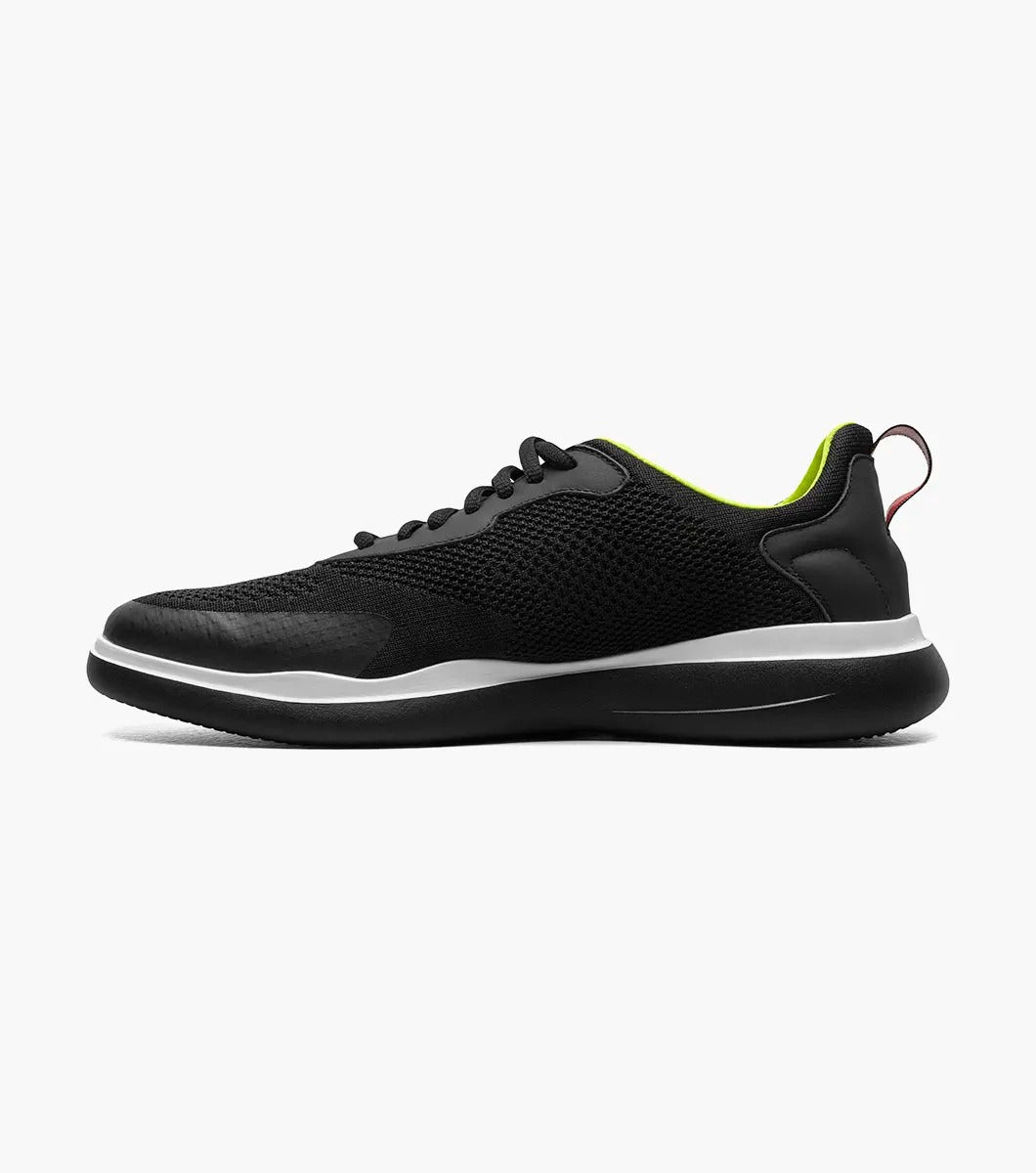 Introducing the Stacy Adams - MAXSON Moc Toe Lace Up Sneaker in black (25517-001) by STACY ADAMS. This stylish sneaker showcases a mesh upper, complemented by a vibrant green interior and a crisp white midsole. Designed for comfort, it features an athletic sole for an easy stride, along with a handy heel pull-tab and coordinating black laces.