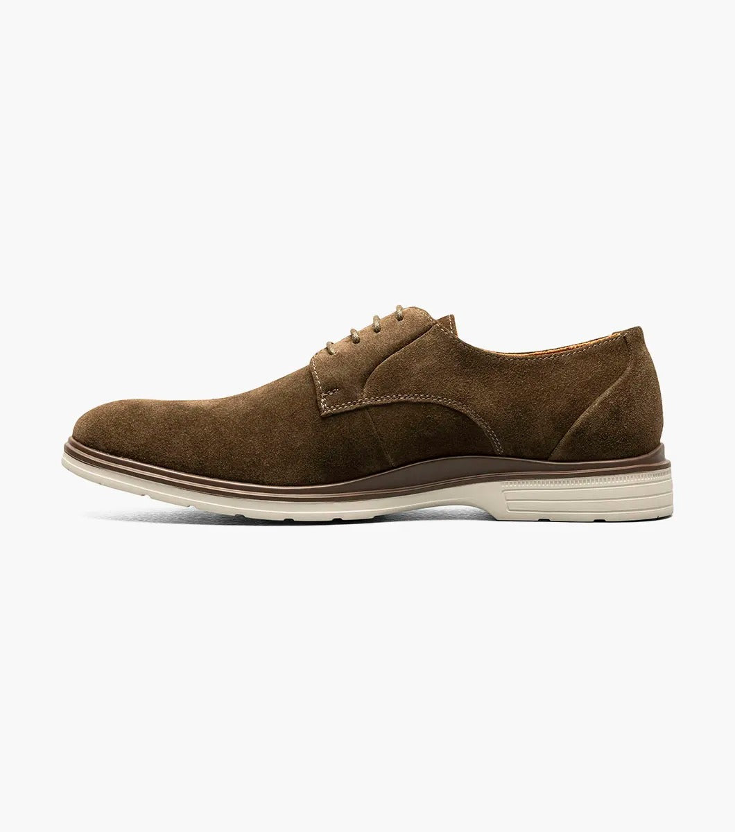 Product: STACY ADAMS presents the TAYSON Plain Toe Lace Up, model 25522-245, featuring a brown suede exterior with a light beige sole and anatomical arch support. This shoe offers a round toe design and laced closure for added comfort and style.